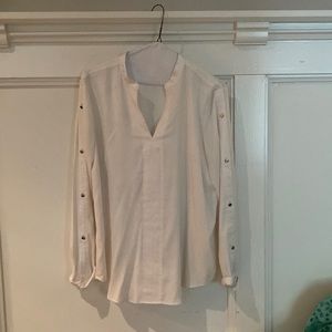 Ivory long sleeved blouse by Ann Taylor; sleeves have gold decorative buttons